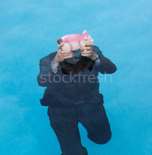 Kıdemli adam kumbara üzerinde su Stok fotoğraf © backyardproductions