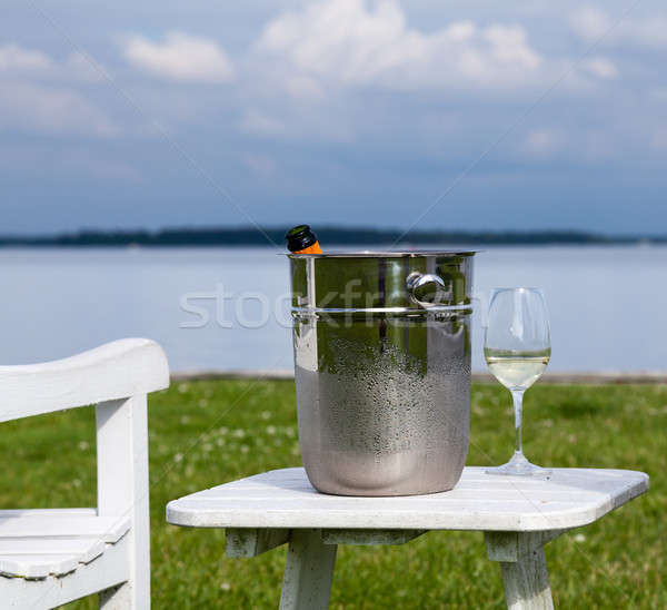 Garden chair and champagne by Chesapeake bay Stock photo © backyardproductions