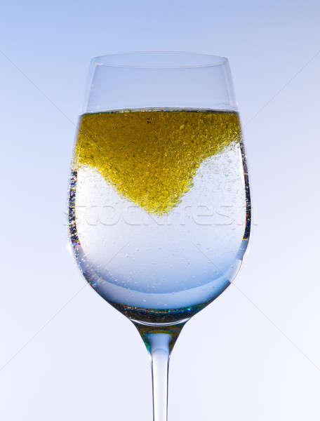 Olive oil stirred into wine glass Stock photo © backyardproductions