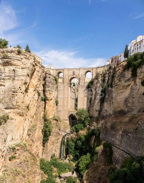 View down the steep rockface to valley in Ronda Stock photo © backyardproductions