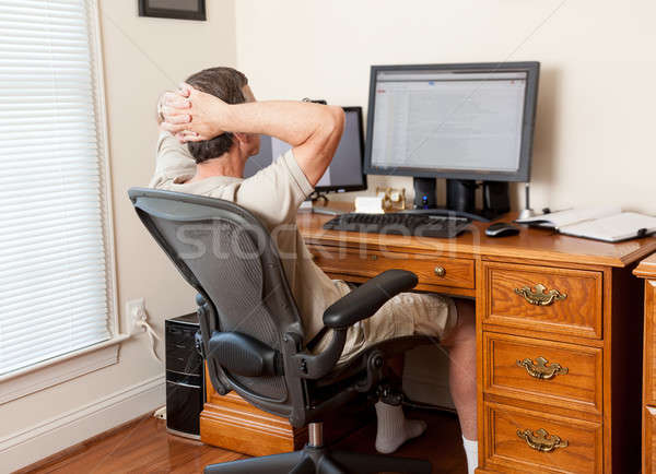 Senior male working in home office Stock photo © backyardproductions