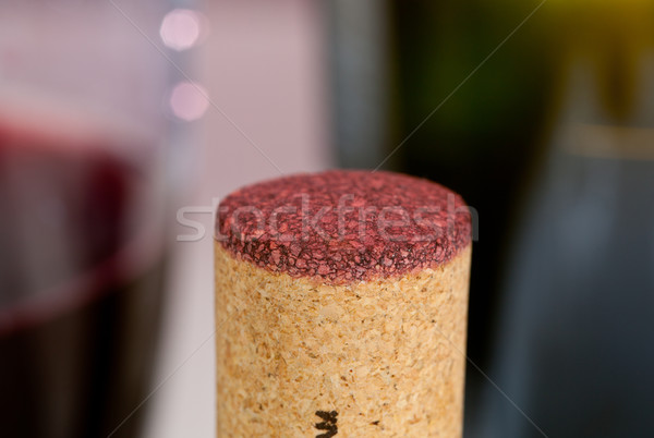 Red wine soaked cork in front of glass Stock photo © backyardproductions
