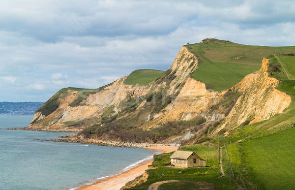 Cottage by cliffs at West Bay Dorset in UK Stock photo © backyardproductions