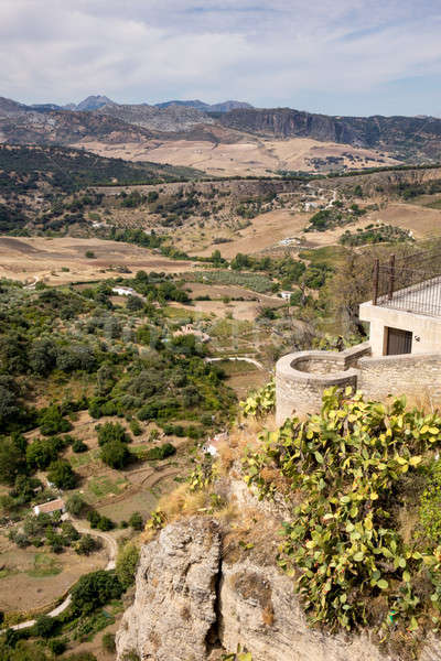 View down the steep rockface to valley in Ronda Stock photo © backyardproductions