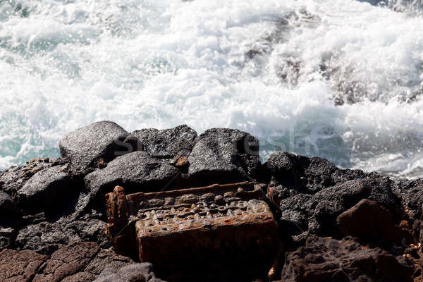 Stock photo: Old engine block dumped by sea