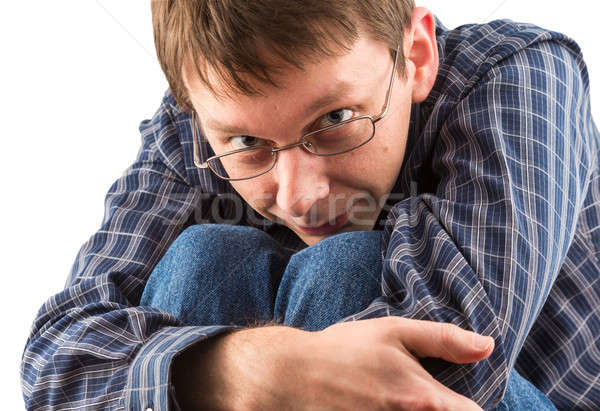 Young caucasian man bent double as though trapped Stock photo © backyardproductions