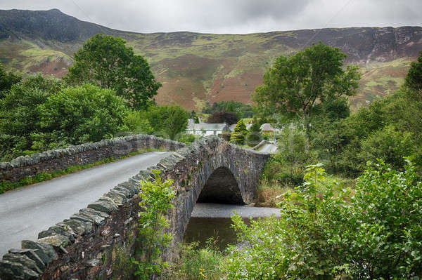 Stock photo: Bridge over small river at Grange in Lake District