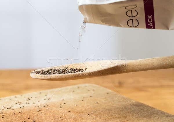 Tiny chia seeds in wooden spoon Stock photo © backyardproductions