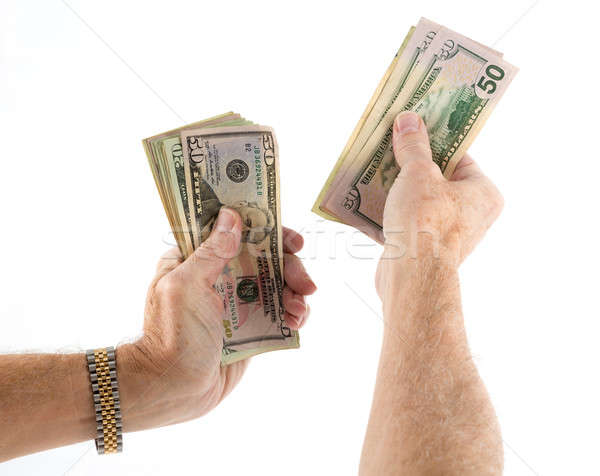 Stock photo: Caucasian ethnicity hands holding fan of US dollar bills