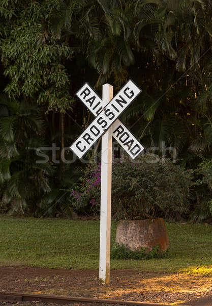 White railroad crossing sign at sunset Stock photo © backyardproductions