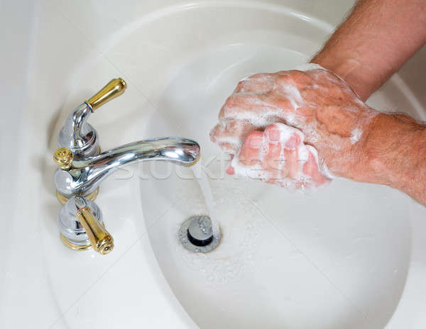 Senior male wash hands with soap Stock photo © backyardproductions