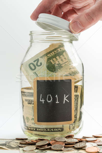 Hand opening glass Jar used for 401K fund Stock photo © backyardproductions