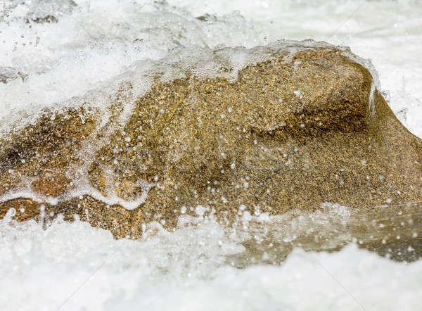 Sharp simple shot of water over rock Stock photo © backyardproductions