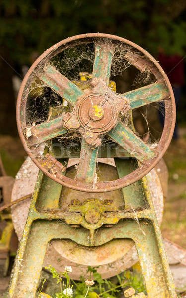 Rusty farm machinery with flywheel Stock photo © backyardproductions