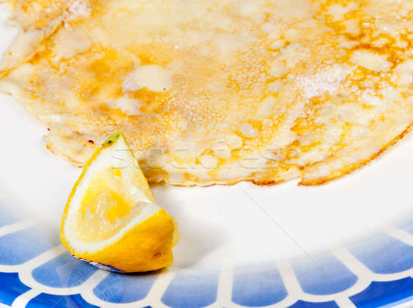 Pancake with lemon on blue plate Stock photo © backyardproductions