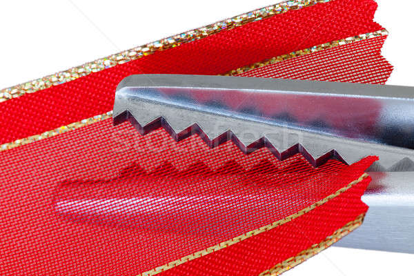 Macro pinking shears or scissors on red ribbon Stock photo © backyardproductions
