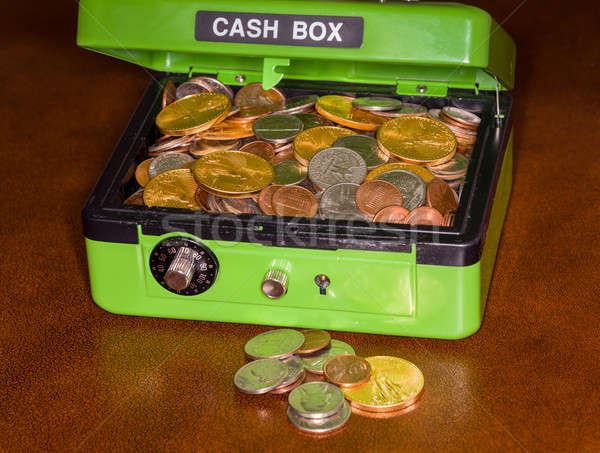 Green cash box with gold and silver coins Stock photo © backyardproductions