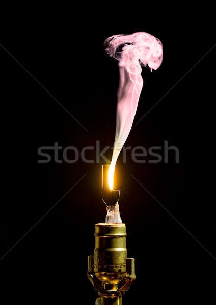 Broken lightbulb flares up in smoke Stock photo © backyardproductions