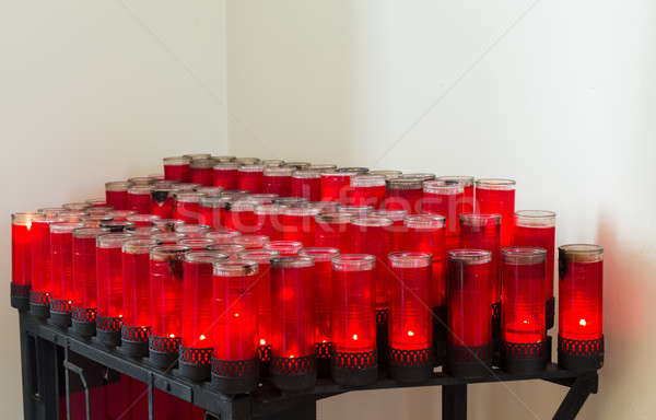 Rows of red votive candles in Catholic church Stock photo © backyardproductions