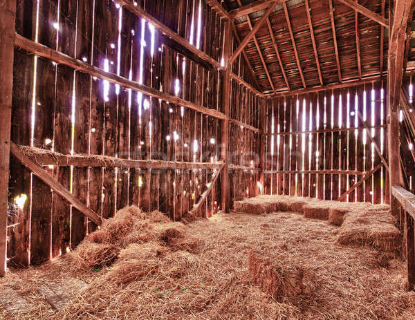 Interior of old barn with straw bales Stock photo © backyardproductions