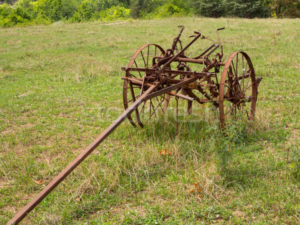 Unused and rusted farm plow in field Stock photo © backyardproductions