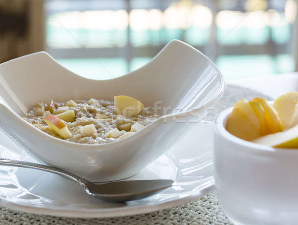 Oatmeal breakfast in modern white bowl Stock photo © backyardproductions