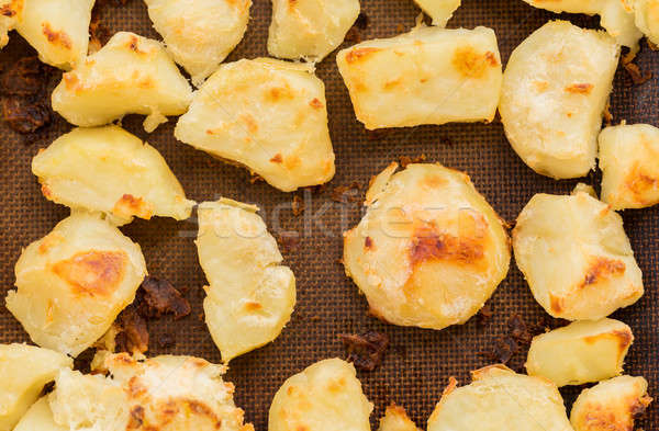 Crispy roast potatoes on silicone sheet Stock photo © backyardproductions