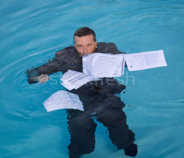 Senior man holding mortgage loan document in water Stock photo © backyardproductions