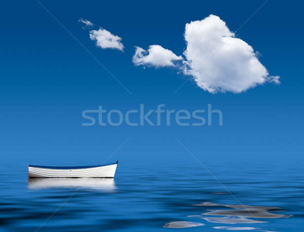 Stock photo: Old rowing boat marooned at sea