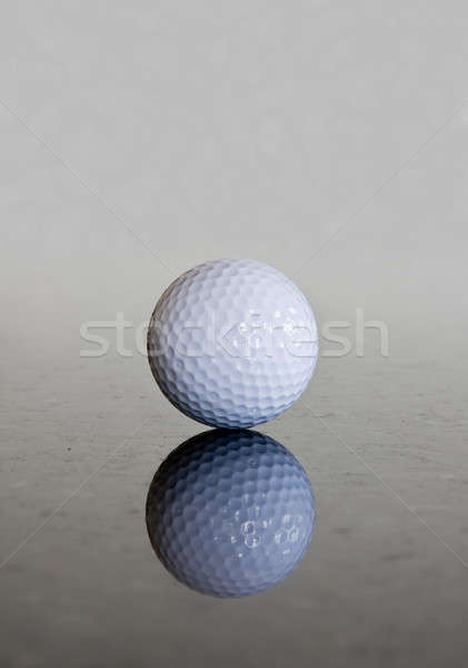 Single golf ball reflection Stock photo © backyardproductions