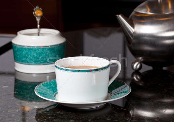Tea poured from stainless steel teapot Stock photo © backyardproductions