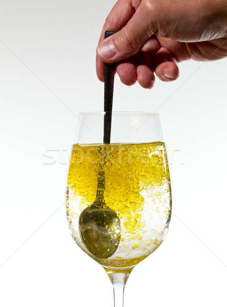 Olive oil being stirred in wine glass Stock photo © backyardproductions