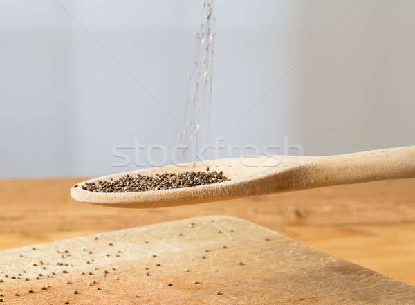 Tiny chia seeds in wooden spoon Stock photo © backyardproductions