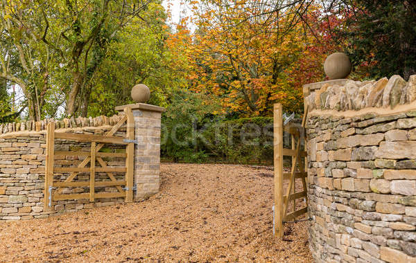 Open wooden gates at entrance to modern house Stock photo © backyardproductions