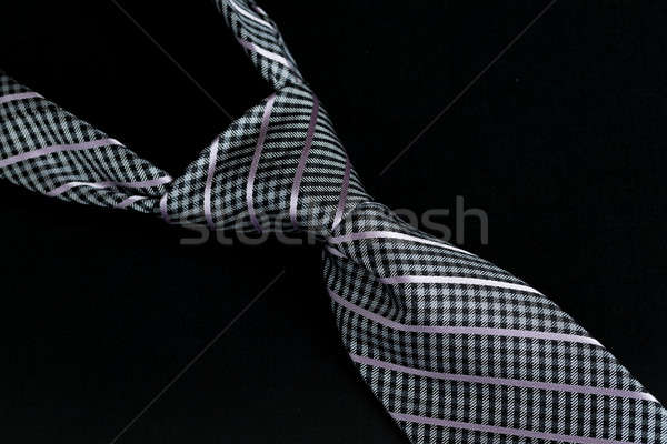 Grey or gray windsor knot on tie isolated against black Stock photo © backyardproductions
