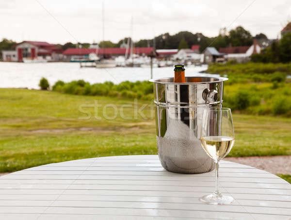 Ice bucket with champagne and glass Stock photo © backyardproductions
