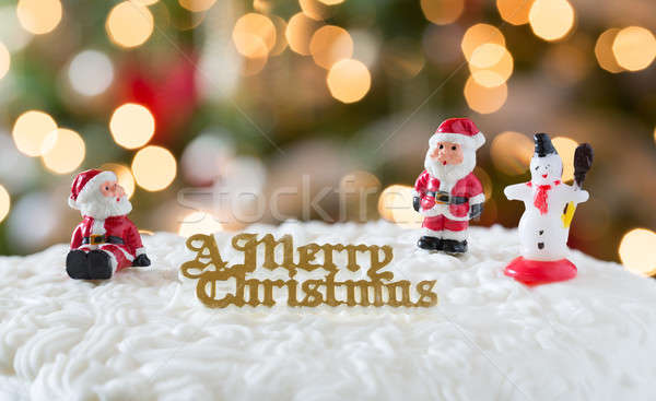 Stock photo: Icing on Christmas cake with tree lights