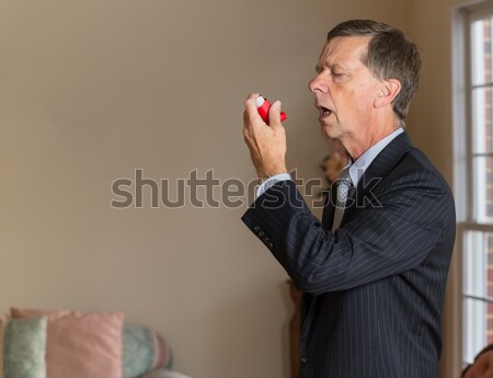 Senior businessman with asthma inhaler Stock photo © backyardproductions