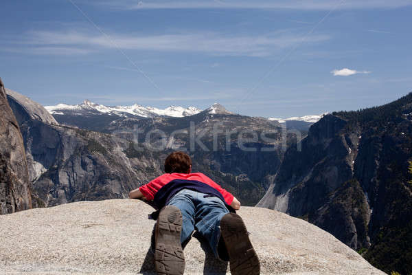 Young hiker lying prone over Yosemite Stock photo © backyardproductions