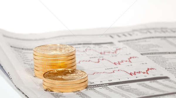 Golden Eagle coins on newspaper Stock photo © backyardproductions
