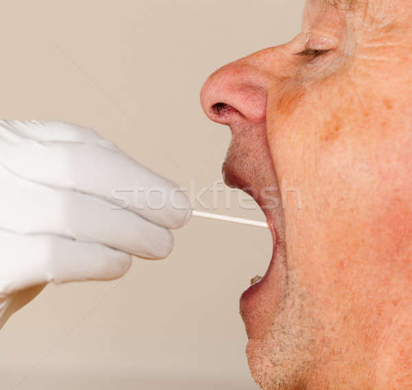 DNA swab of saliva taken from senior man Stock photo © backyardproductions
