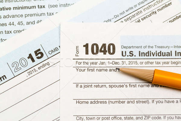 Pencil laying on 2015 IRS form 1040 Stock photo © backyardproductions