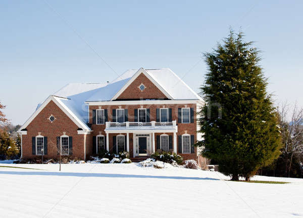 Modern single family home in snow Stock photo © backyardproductions