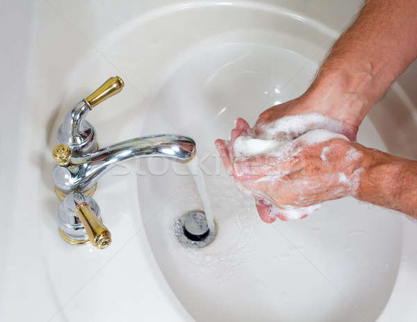 Stock photo: Senior male wash hands with soap