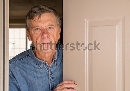 Senior man staring into cardboard box Stock photo © backyardproductions