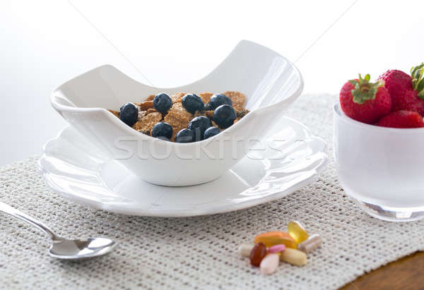 Breakfast of bran flakes blueberries Stock photo © backyardproductions