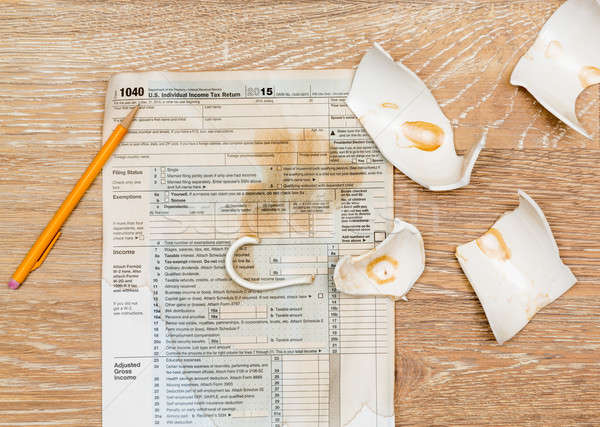 Coffee spilt on 2015 IRS form 1040 Stock photo © backyardproductions