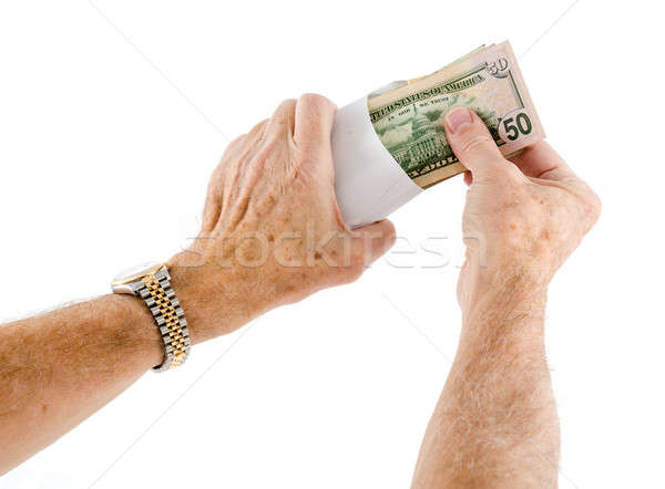 Caucasian ethnicity hands putting fifty dollar bills in envelope Stock photo © backyardproductions