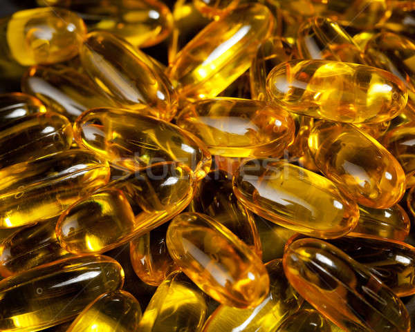 Close up of fish oil capsules Stock photo © backyardproductions