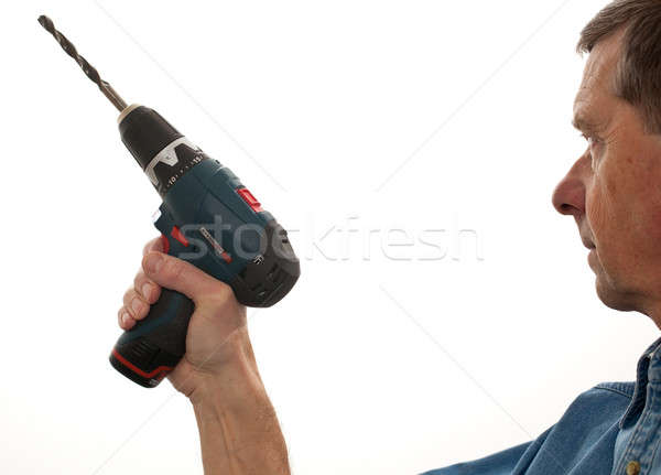 Senior man holding a power drill Stock photo © backyardproductions